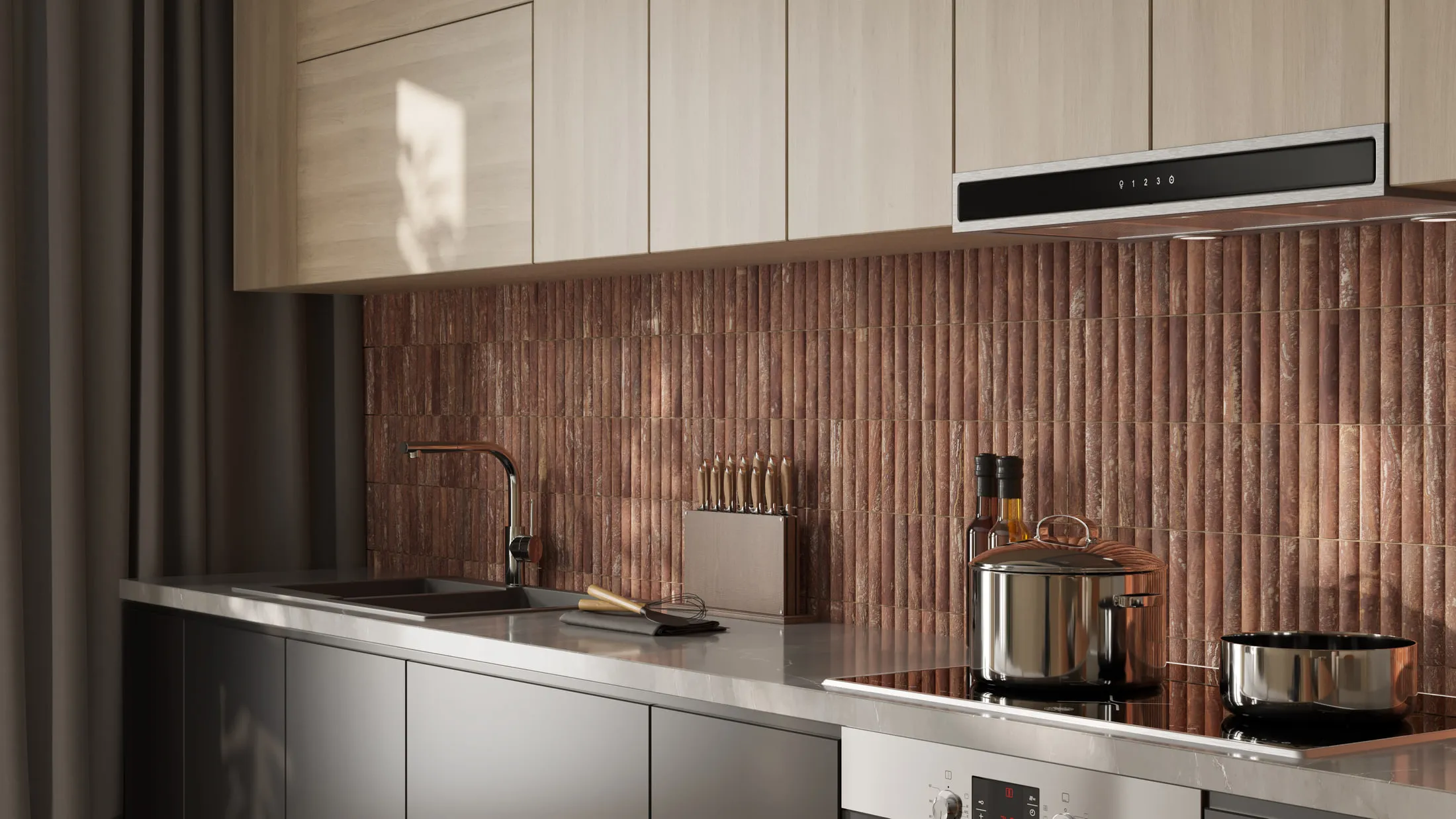The same fluted terracotta tile used as a kitchen splashback, running behind a stainless hob and brass tap beneath cream wall cabinets.